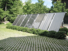 Grassy pavers in front of solar collectors